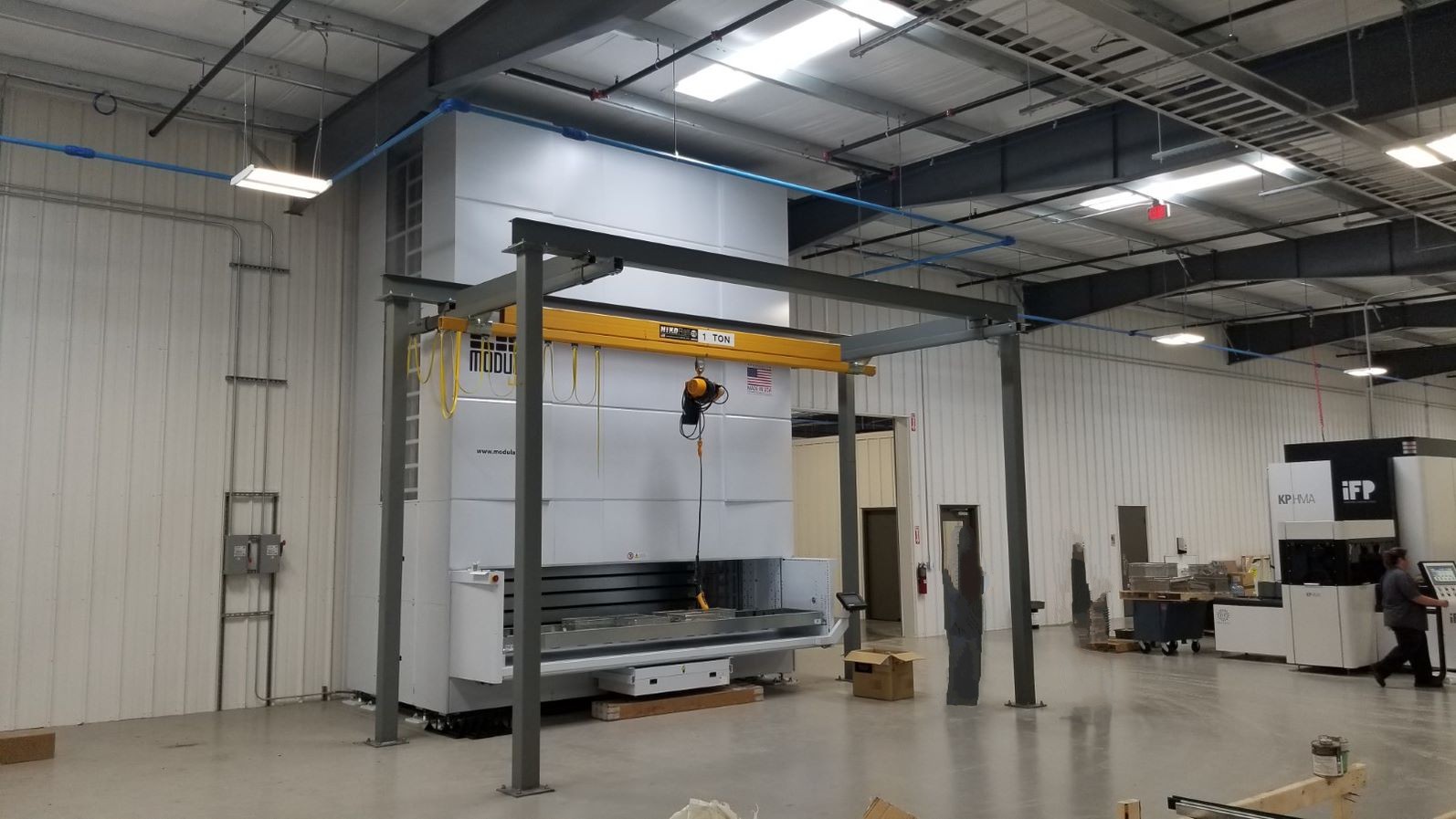 Vertical Lift Module with External Bay to pick material overhead with a Workstation Crane